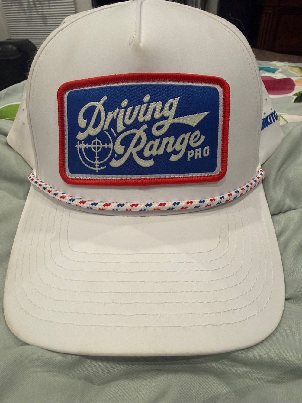 Bright white Driving Range Pro White Trucker Hat with Red & Blue Patch